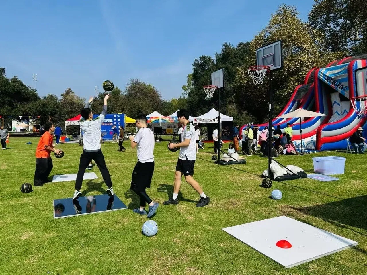 Children at the basketball skill station in the Challenge Zone.