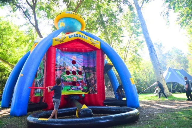 A baseball-themed inflatable in the Play Zones.